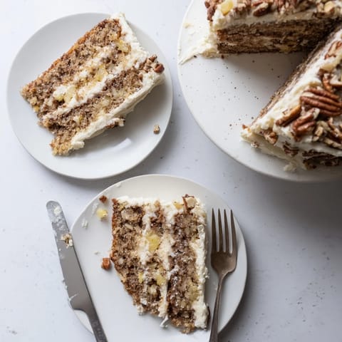 Sliced Hummingbird Cake showing tender crumb, crushed pineapple, and ripe banana interior on a rustic dessert plate.